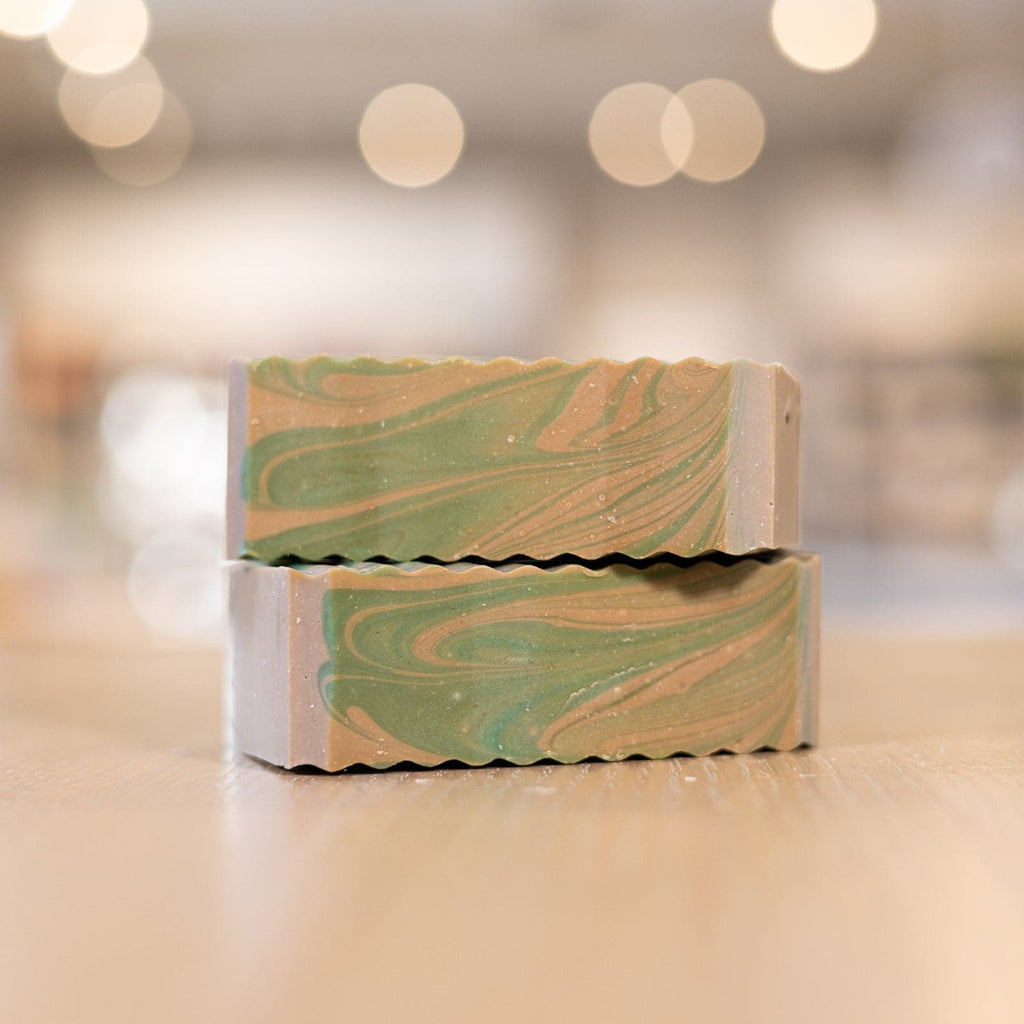 Two Commando Soap Bars with green and brown colors stacked on counter