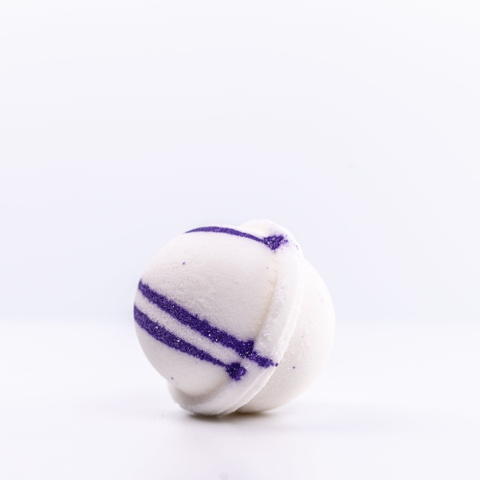 Lavender Bath Bomb with dark purple design against white background