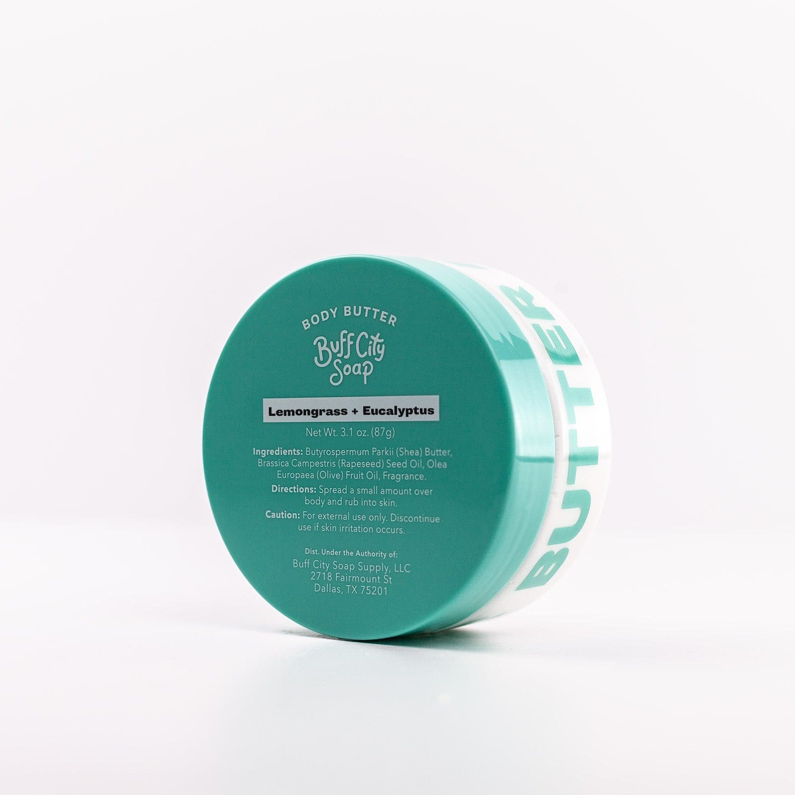 Buff City Soap's lemongrass + eucalyptus scented body butter lid listing precautions angled