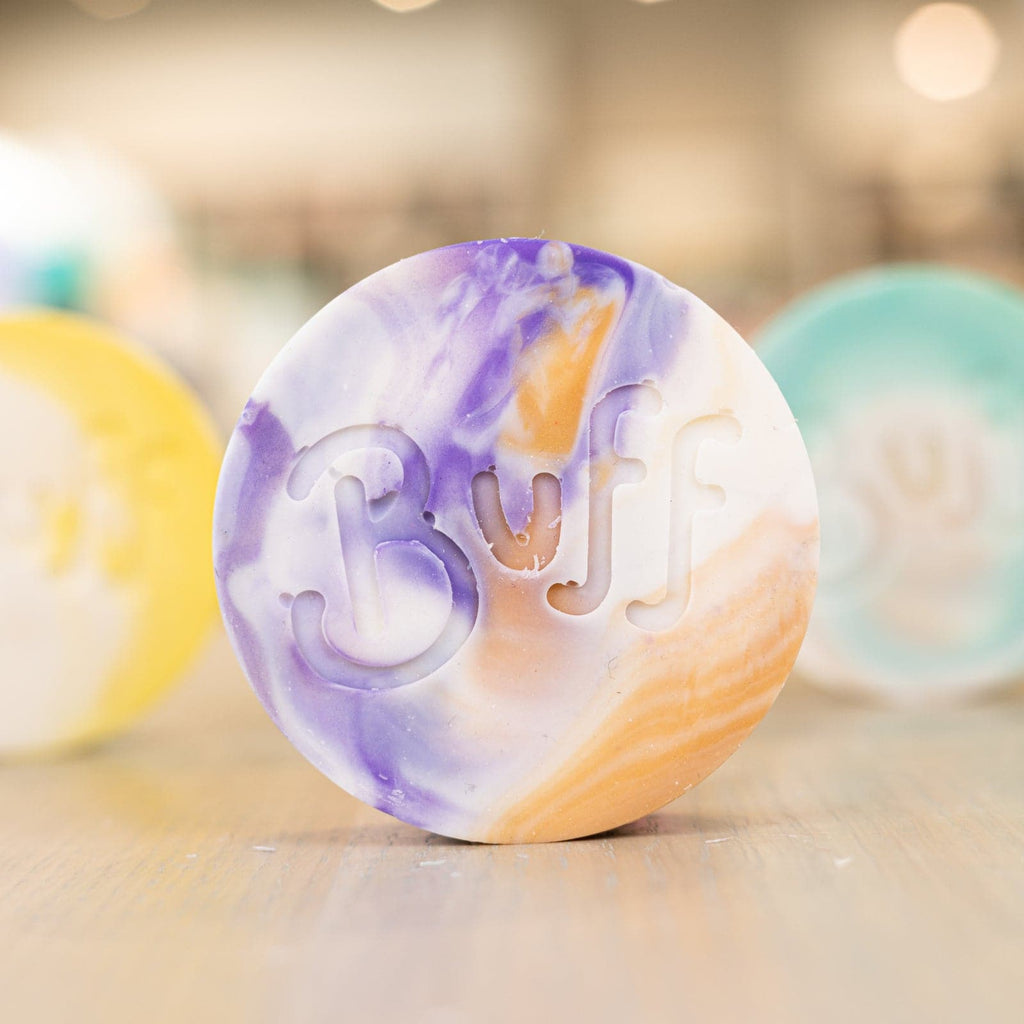 Buff City Soap's love potion multi-colored shave bar with a buff inscription