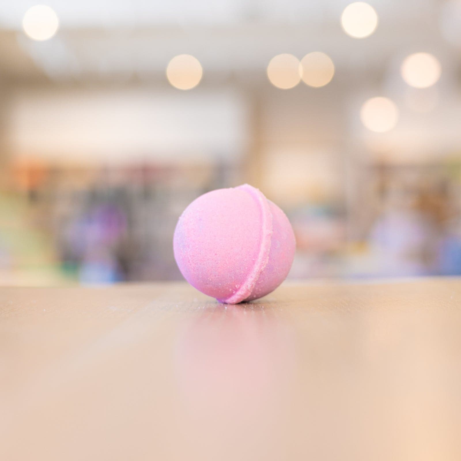 pink Mermaid Mini Bath Bomb laying on it's side