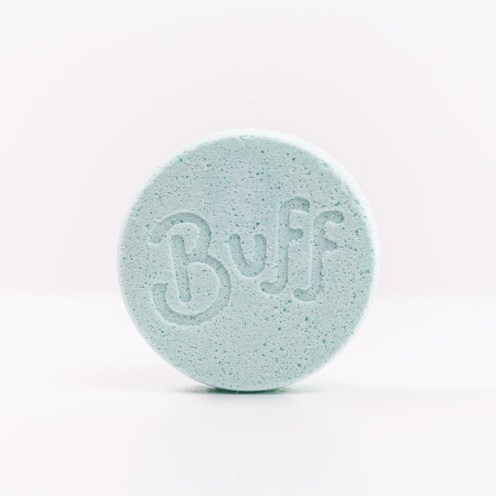 light blue Narcissist Shower Fizzy with "Buff" engraved in it