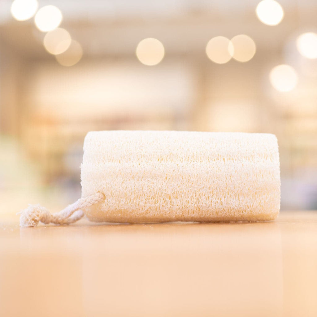 Natural Loofah resting on side on top of wooden counter